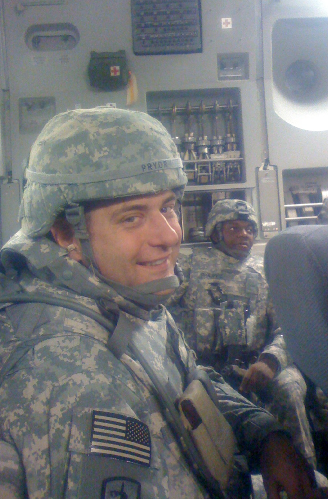 John P. Pryor, MD, wearing camouflage scrubs and helmet
